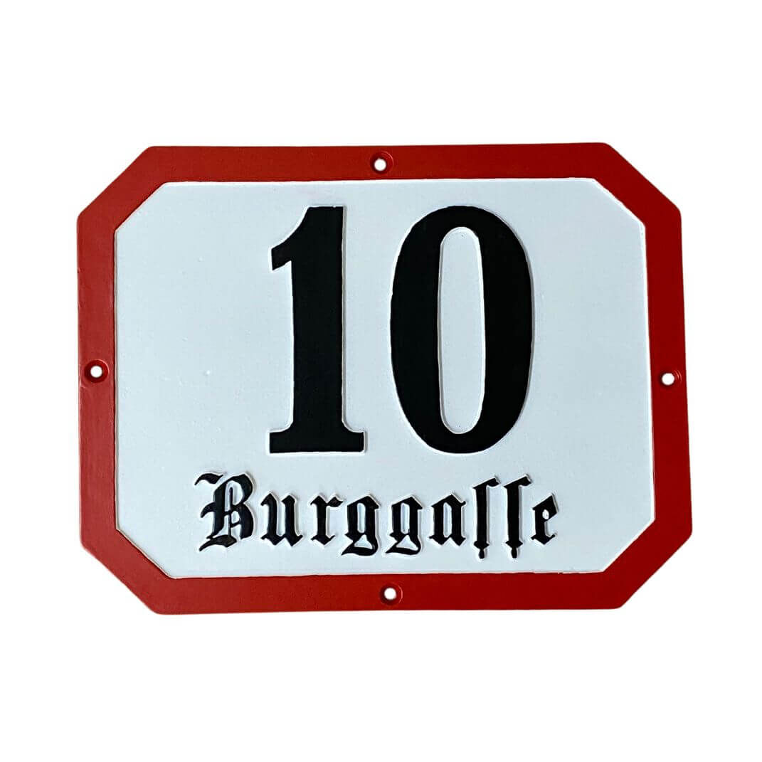 achteckiges Altstadtgussschild mit roter Umrandung und schwarzer Frakturschrift achteckiges Altstadtgussschild mit roter Umrandung und schwarzer Frakturschrift